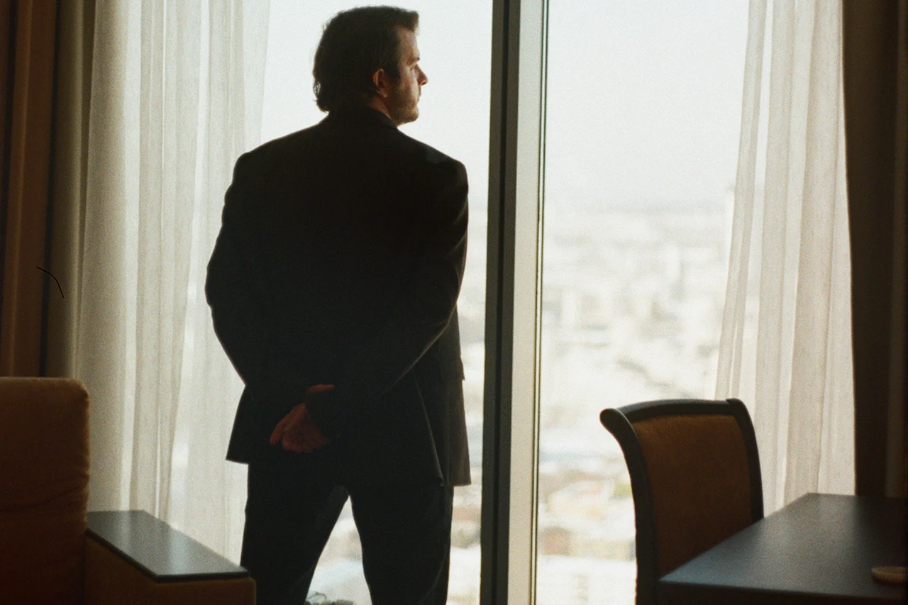 Executive looking out of an office window